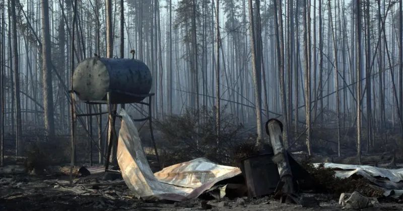 Tok residents take stock of damage as Mukluk Fire continues to threaten the community