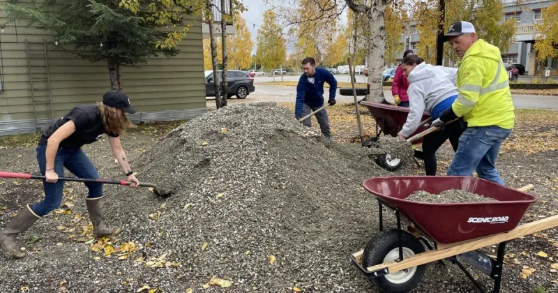 United Way Day of Caring: Volunteers freshen up outdoor area for The Door