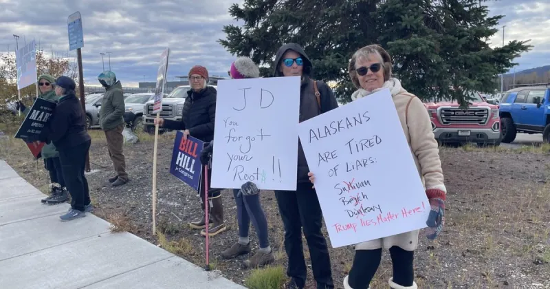 Protesters rally during Vance visit
