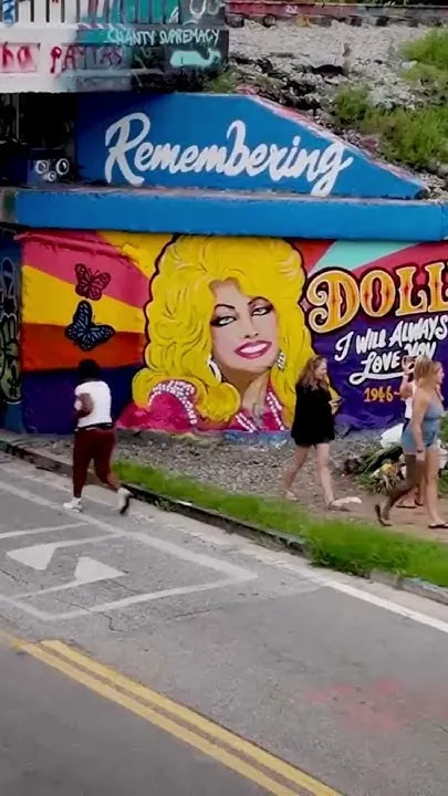 Dolly Parton memorialized with Graffiti Bridge mural in Pensacola (Video)