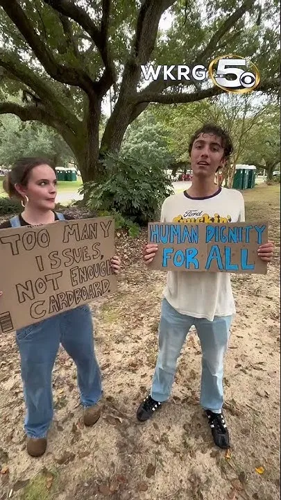 Protestors share thoughts before President Trump's rally in Mobile (Video)