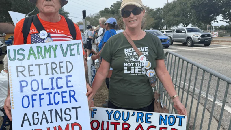Protesters gather outside Mitchell Center ahead of Trump's Mobile rally