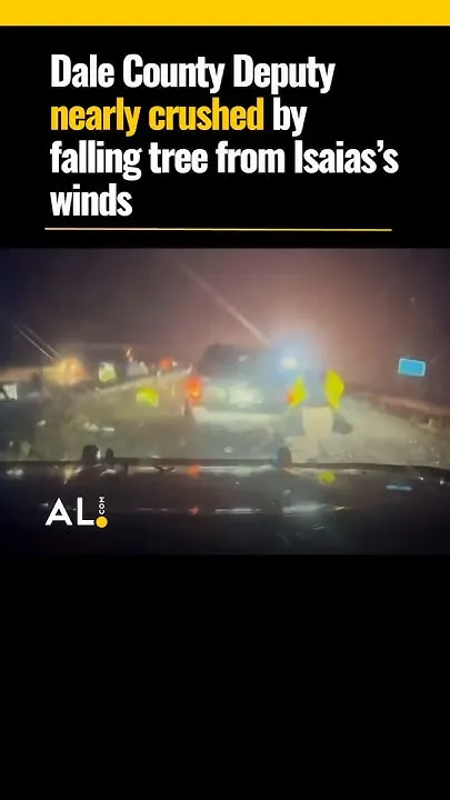 Dale County Alabama Sherrif's deputy nearly crushed by falling tree from hurricane winds. (Video)