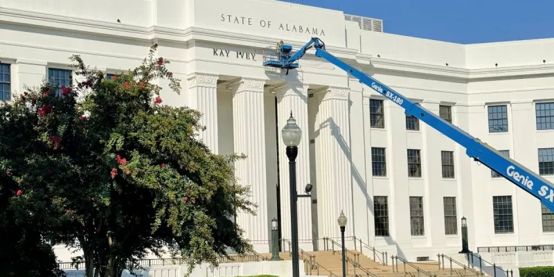 Crews install signage for Kay Ivey Office Building