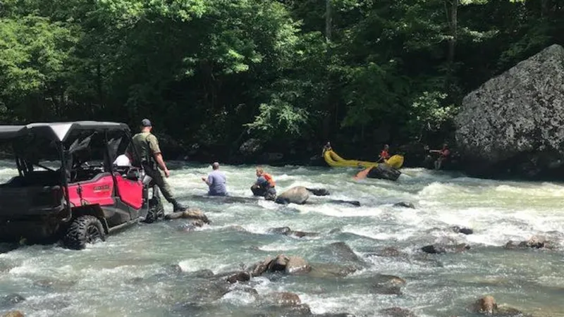 Multi-agency teams free man pinned under canoe in Mulberry River