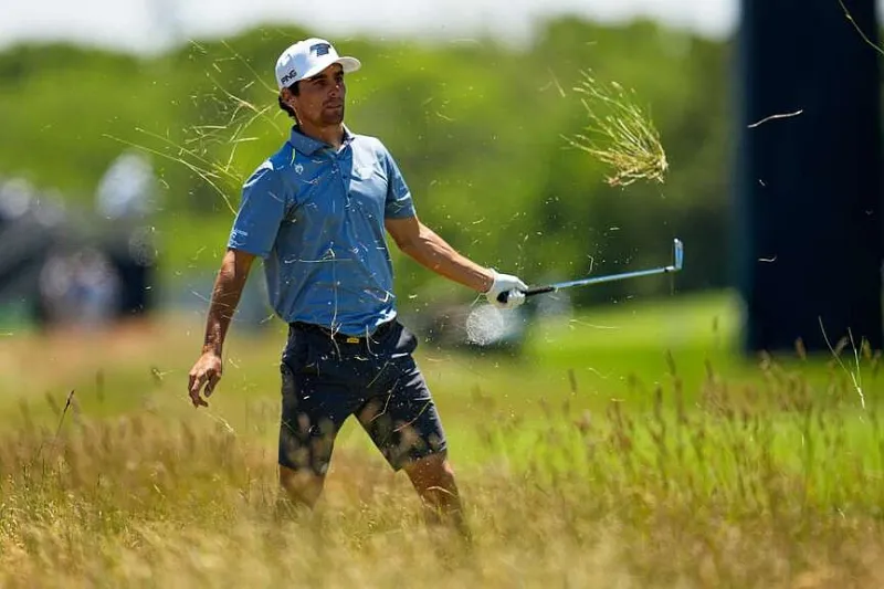Niemann throws club, but makes cut