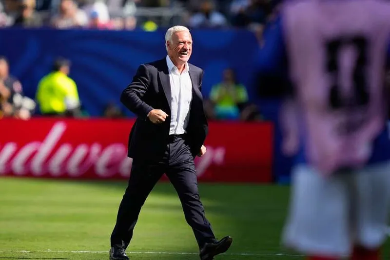 France coach back after mom's death