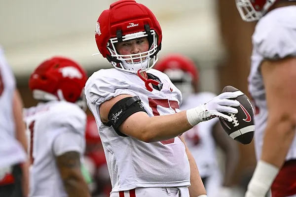 Arkansas football freshman center Carey Clayton learned position from his father, uncles