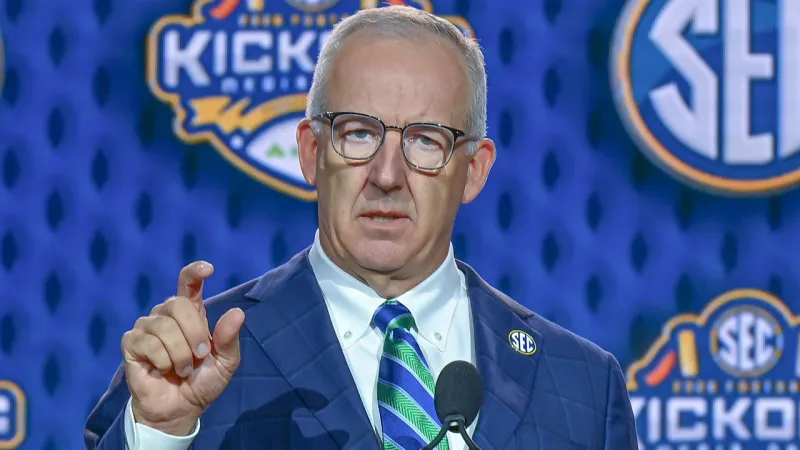SEC commissioner Greg Sankey with the media in the main room