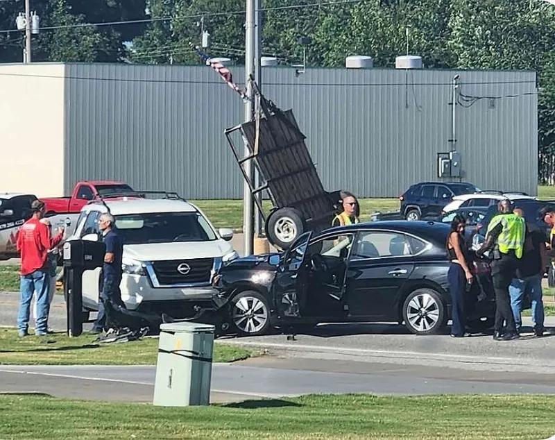 Motor-vehicle collision upends trailer