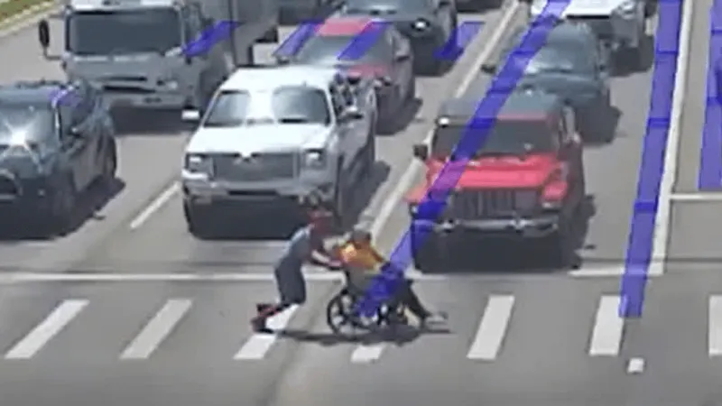 Jonesboro "Spider-Man" swoops in to help disabled person cross a crosswalk in traffic