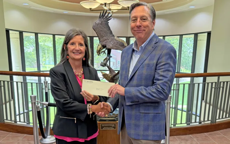 First National Bank of Commerce Presents Gift to WBU
