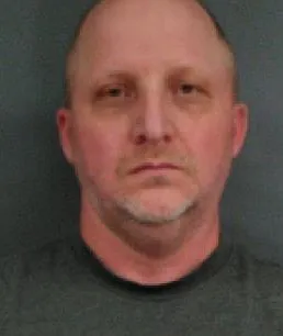 Former Mansfield officer who pawned guns from department to pay utility bill gets suspended prison term
