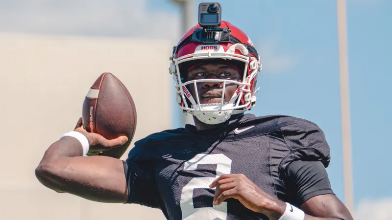 Razorback quarterbacks AJ Hill, KJ Jackson after practice Friday