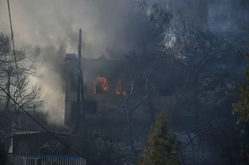 Wildfires battled in Belgium, Greece