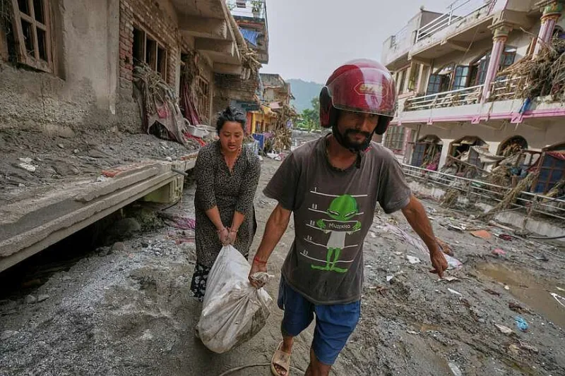 Deaths in Nepal, China floods rise