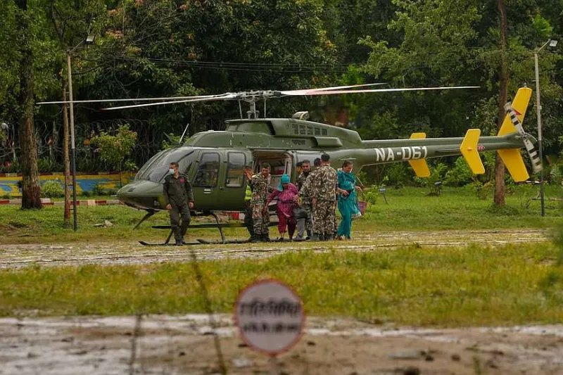 Survivors of Nepal, China floods reach safe havens