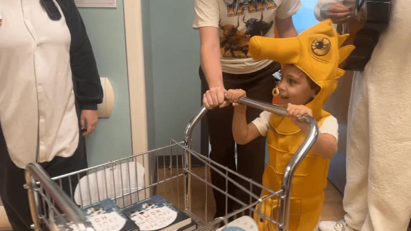 Local family turns son's NICU experience into 1,300-book donation to UAMS