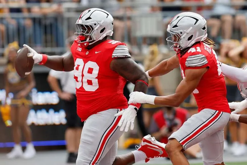 Smith sets Ohio State career receiving mark as 6th-ranked Buckeyes roll past Kent State 59-3