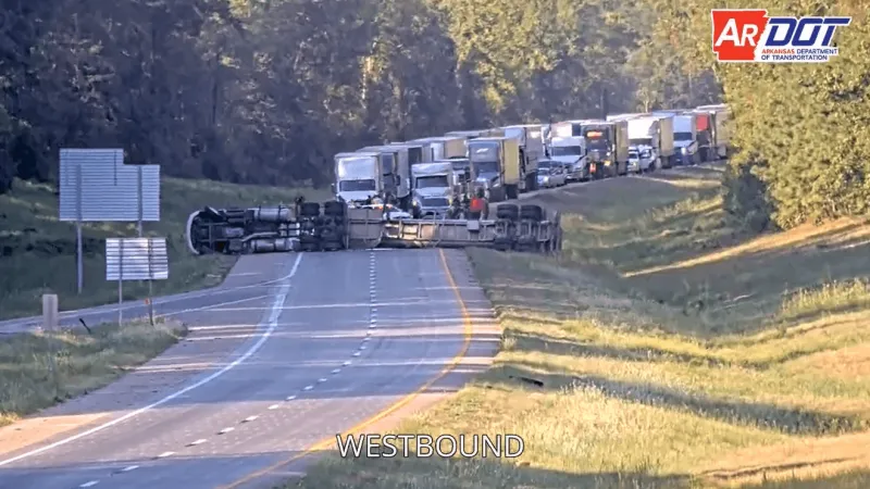 Overturned semi blocking all lanes of eastbound traffic on I-30