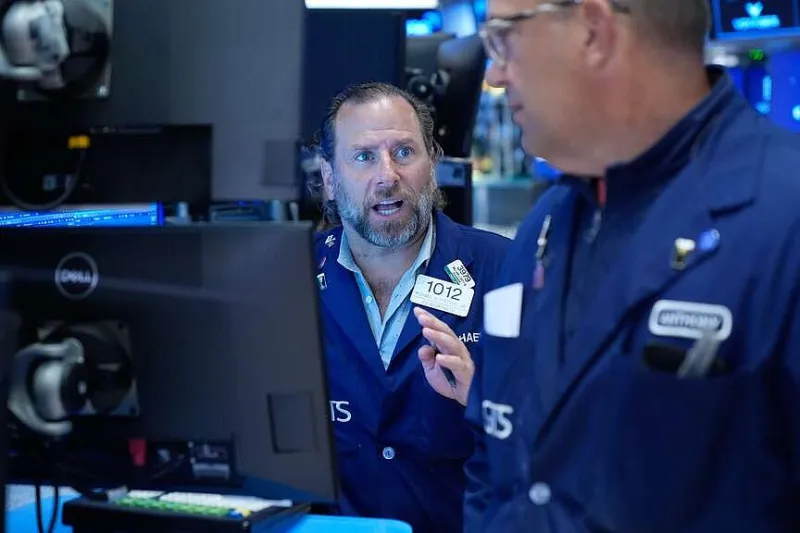 Stock market holds near record as oil prices drop