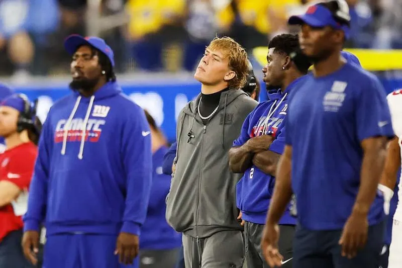 Giants QB Jaxson Dart is done for the regular season with a knee injury, Coach John Harbaugh says