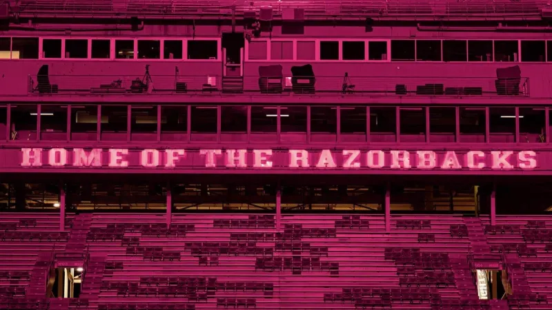 Pink-lit Razorback Stadium honors two Woodland Junior High students killed in UTV crash