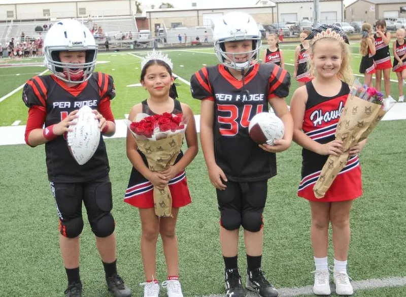 Pee Wee Blackhawks celebrate homecoming