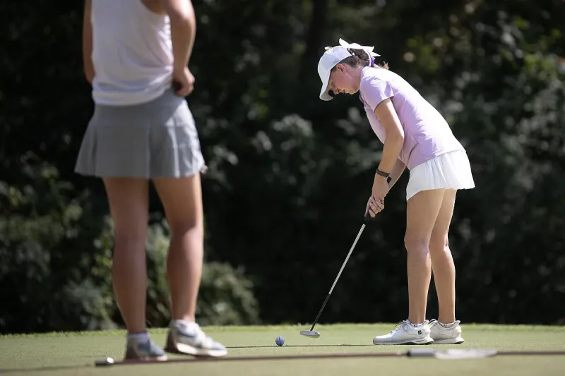Rogers freshman Caroline Hill defeats her friend, Mount St. Mary senior Lillie York, for Class 6A girls golf state title