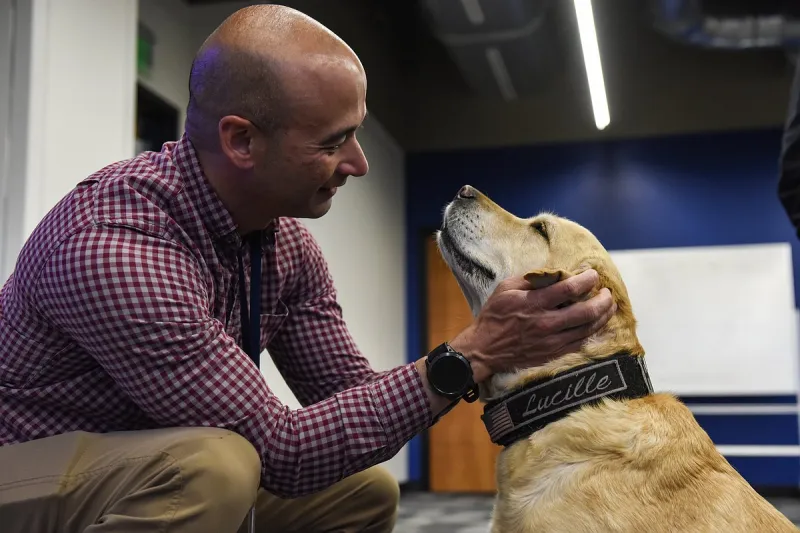 Arkansas State Police evidence dog visits UALR cybersecurity students