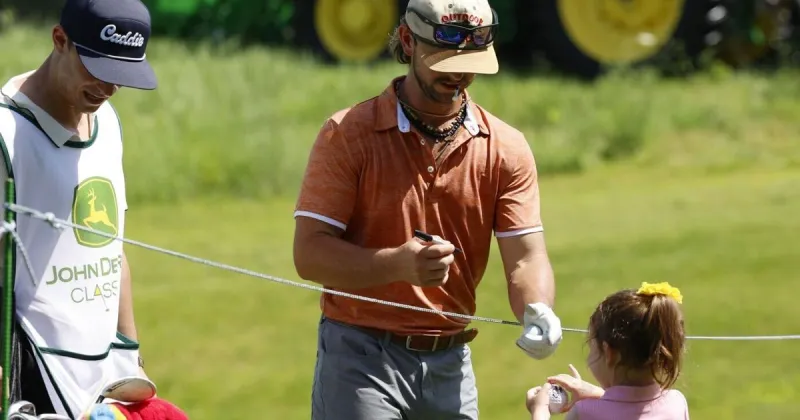 Kids line up to get autographs from the Savannah Bananas at the John Deere Classic