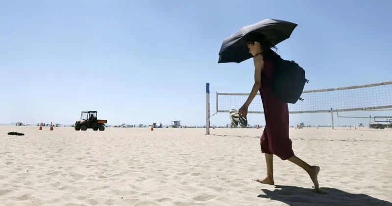 Phoenix extends record-breaking heat as West faces fire threat