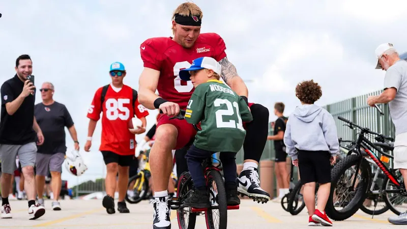 Cardinals Pedal To Practice During Memorable Green Bay Tradition