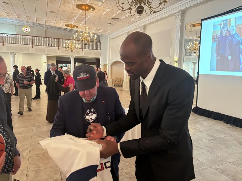 UConn men's basketball great Emeka Okafor honored with his wife at Franciscan banquet