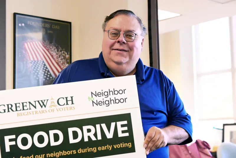 Greenwich voters cast ballots and donate food at the polls