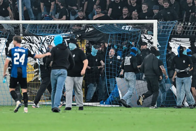 German Cup match marred by fireworks, pitch invasion