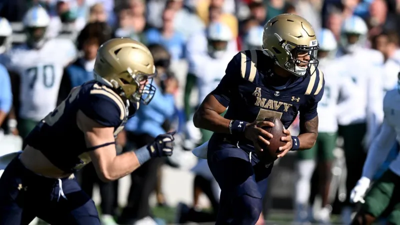Woodson rushes for 200 yards and 3 scores, Navy beats Towson 42-15