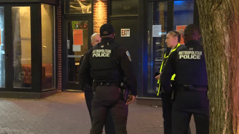 Notice of closure posted at Caf 8 after National Guard member shot near Eastern Market