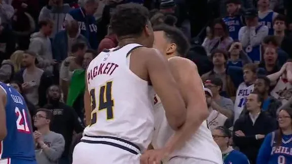 Brown's goaltended layup in OT lifts short-handed Nuggets over 76er...