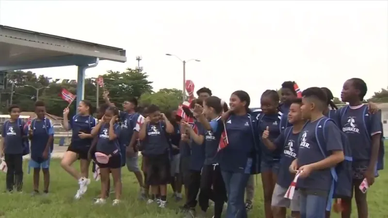 Miami students chosen as player escorts for Norway vs. England quarterfinal match