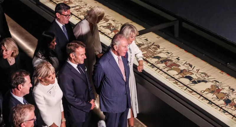 Macron and King Charles III hail their nations' ties as they view the Bayeux Tapestry in London