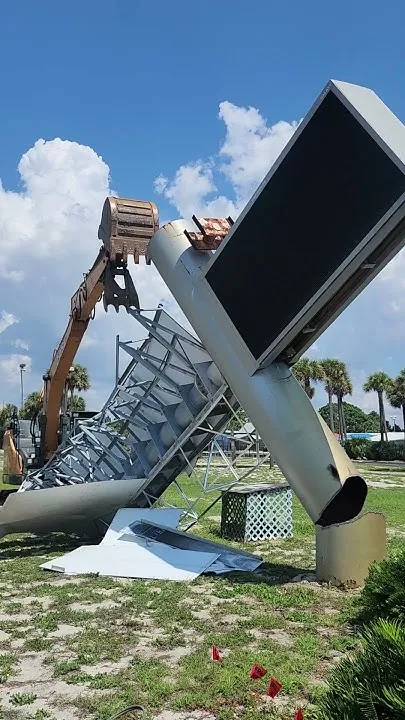 Old sign comes down at Destin-Fort Walton Beach Convention Center to make way for new one. (Video)