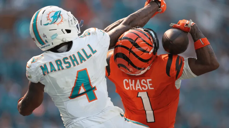 Burrow throws 4 TDs, Battle has pair of interceptions as Bengals beat Dolphins 31-24
