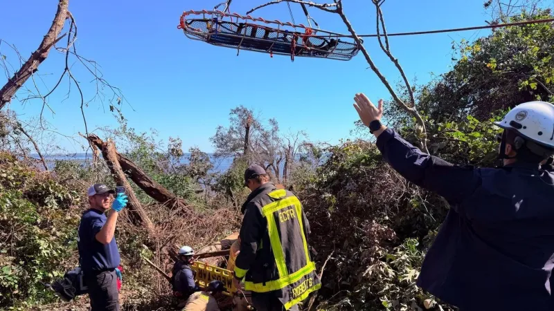 Escambia County crews rescue victim knocked by crane into 25-foot embankment