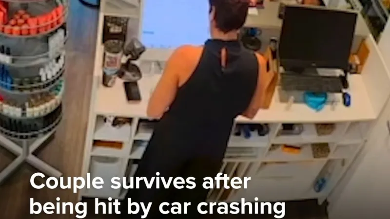Couple survives after being hit by car crashing through nail salon