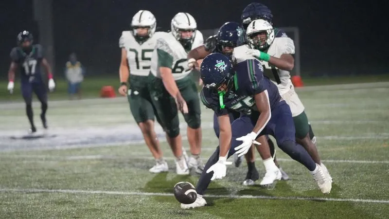 Historic Day on Defense Give Football a Soggy Win over Thomas