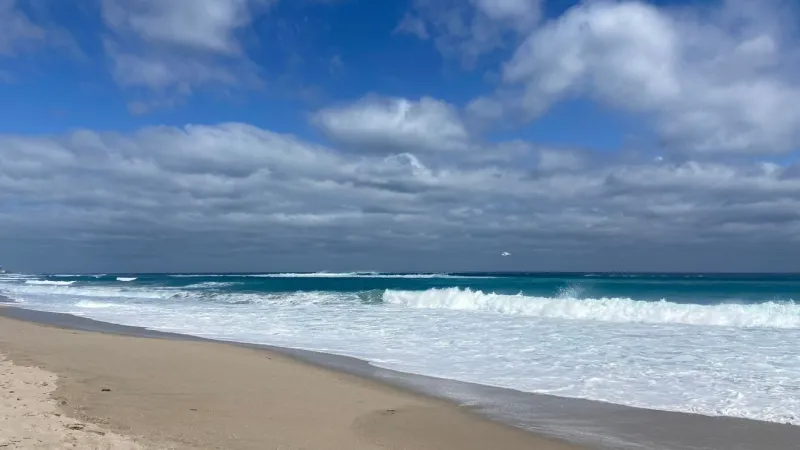 Another breezy day with rough conditions along the coast