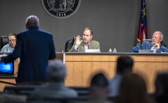 Should a commissioner removed for open meetings violations serve on Hall County advisory panel?