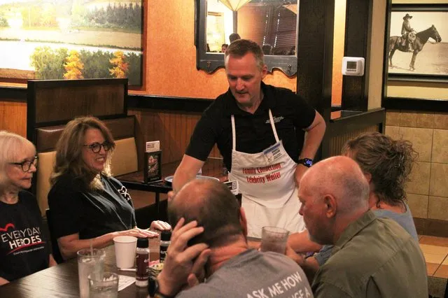 PHOTOS: Local nonprofit holds annual fundraiser with local "celebrities" serving breakfast
