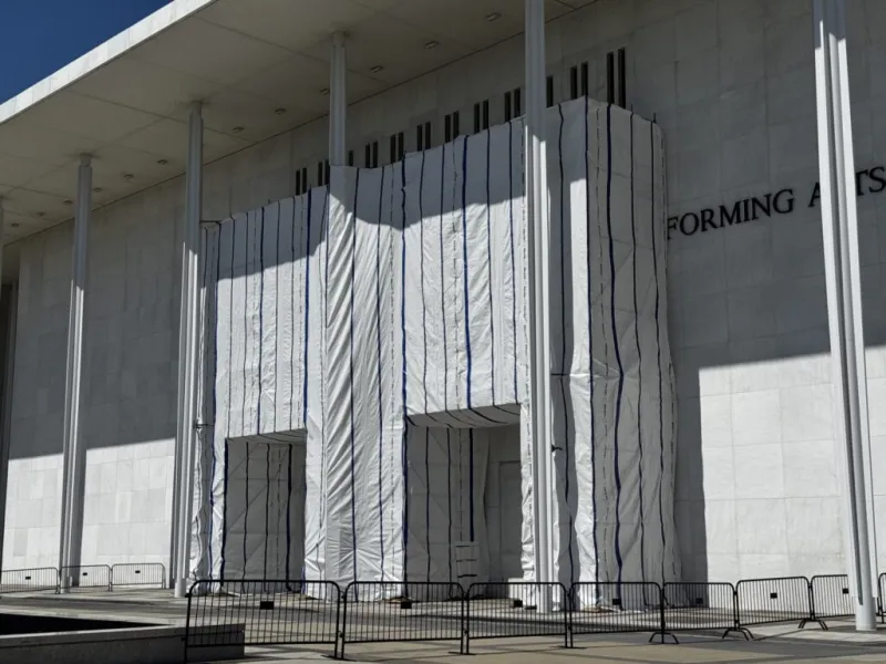 Kennedy Center facade blocked from public view by tarp after Trump's name removed